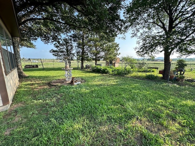 view of yard with a rural view