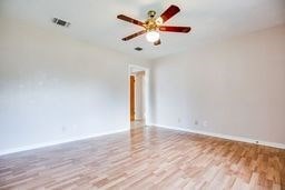 1246 E 20th St, San Angelo, TX 76903 - unfurnished room featuring wood finished floors and a ceiling fan