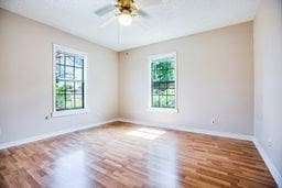 1246 E 20th St, San Angelo, TX 76903 - spare room featuring wood finished floors and a ceiling fan