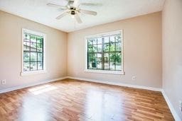 1246 E 20th St, San Angelo, TX 76903 - unfurnished room featuring wood finished floors and ceiling fan