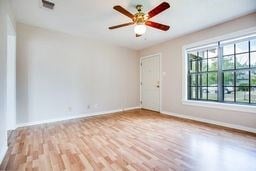 1246 E 20th St, San Angelo, TX 76903 - empty room featuring wood finished floors and baseboards