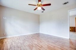 1246 E 20th St, San Angelo, TX 76903 - empty room with wood finished floors and a ceiling fan