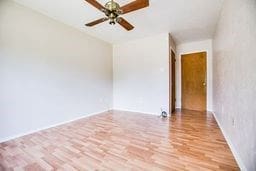 1246 E 20th St, San Angelo, TX 76903 - spare room with wood finished floors and ceiling fan