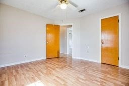 1246 E 20th St, San Angelo, TX 76903 - spare room featuring wood finished floors and a ceiling fan