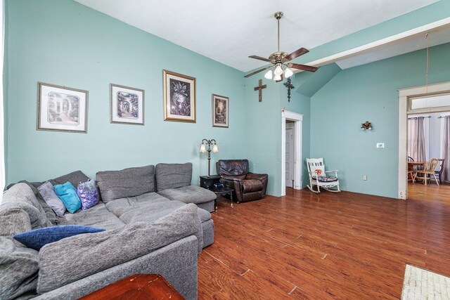 living room featuring ceiling fan, lofted ceiling, and dark hardwood / wood-style flooring