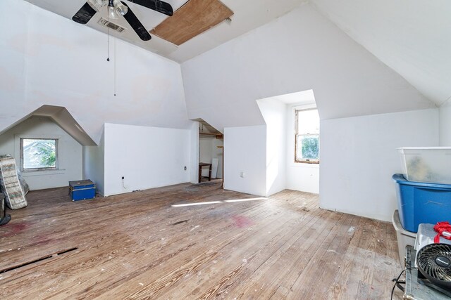 bonus room with ceiling fan, vaulted ceiling, and light wood-type flooring