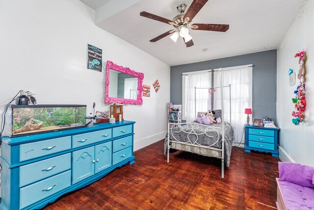 bedroom featuring dark hardwood / wood-style flooring and ceiling fan