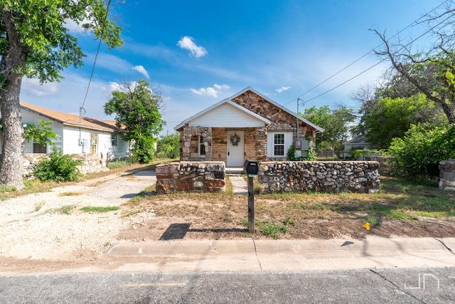 1317 18th St, San Angelo, TX 76903 - bungalow with stone siding and a porch
