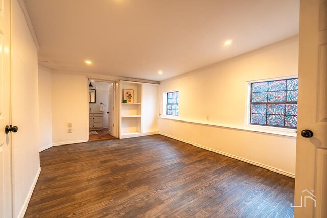 unfurnished bedroom featuring dark wood-style floors, recessed lighting, and baseboards