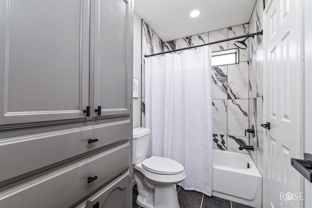 bathroom featuring toilet, tile patterned flooring, and shower / bath combo with shower curtain