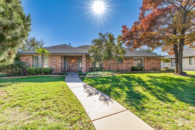 ranch-style house with a front lawn