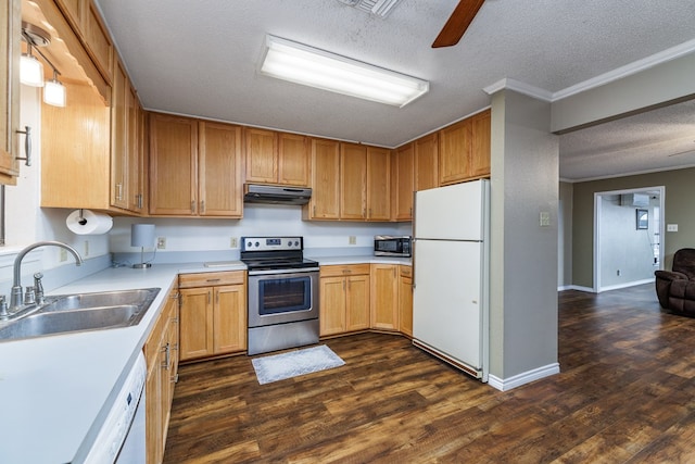 kitchen featuring dark wood-style floors, appliances with stainless steel finishes, ornamental molding, a sink, and under cabinet range hood