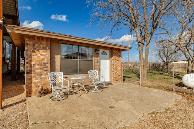 view of patio / terrace featuring fence