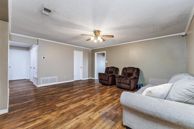 living area featuring ceiling fan, visible vents, crown molding, and wood finished floors