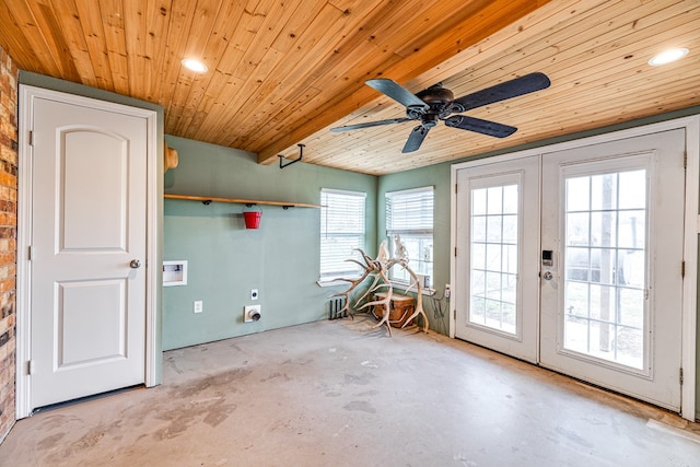 empty room featuring french doors, wooden ceiling, unfinished concrete flooring, and ceiling fan