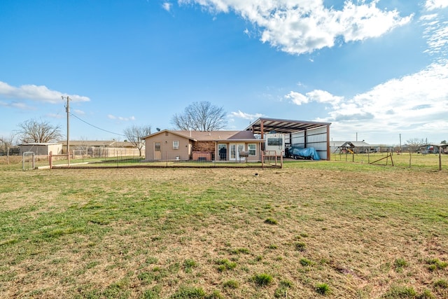 exterior space featuring a detached carport and fence