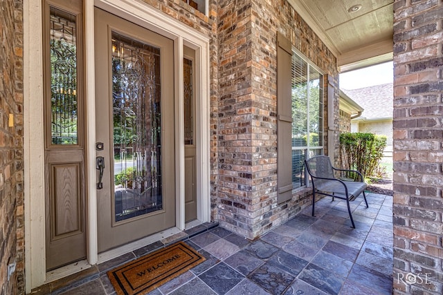 4833 N Bentwood Dr, San Angelo, TX 76904 - entrance to property with a porch and brick siding