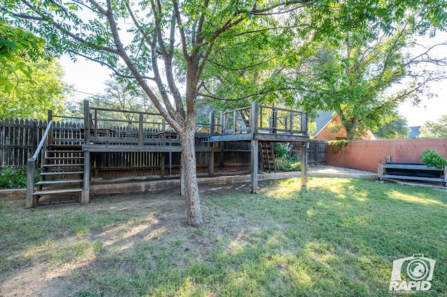 view of yard with a wooden deck