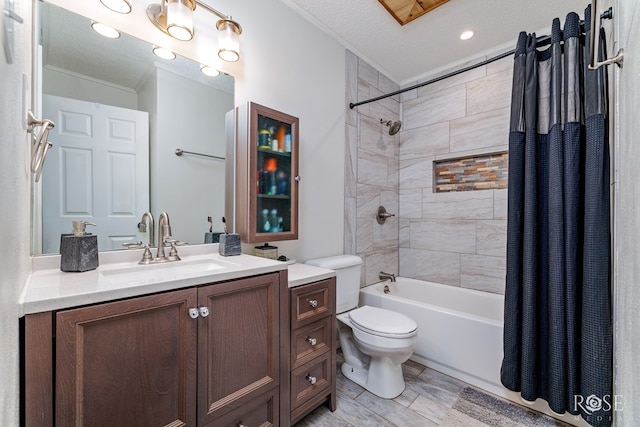 full bathroom with vanity, a textured ceiling, toilet, and shower / bath combo with shower curtain