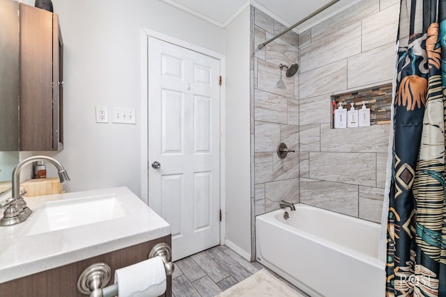 bathroom with ornamental molding, vanity, hardwood / wood-style floors, and shower / bath combo with shower curtain