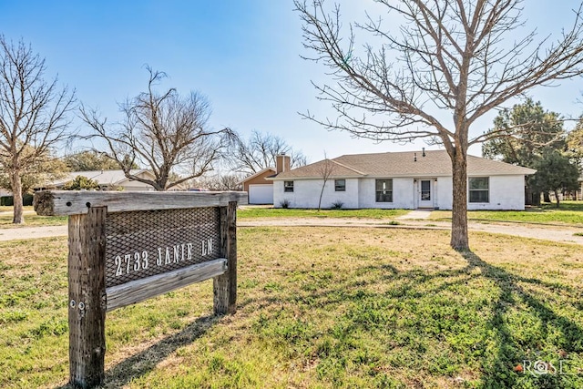 exterior space with a front lawn