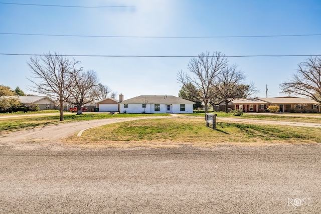 ranch-style home featuring a garage