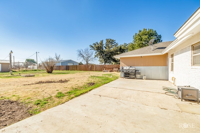 view of yard with ac unit and a patio area