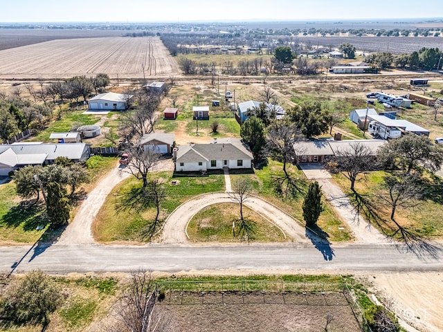 birds eye view of property with a rural view