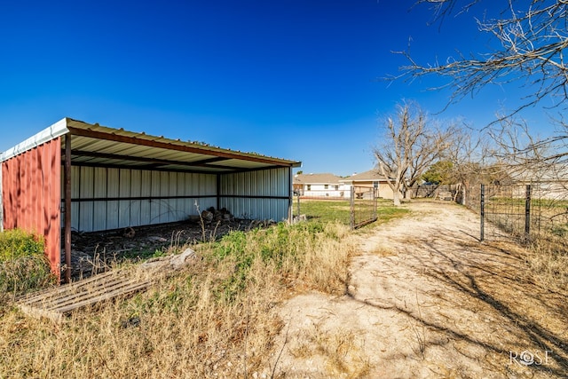 view of property exterior featuring an outdoor structure