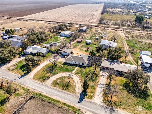 birds eye view of property with a rural view