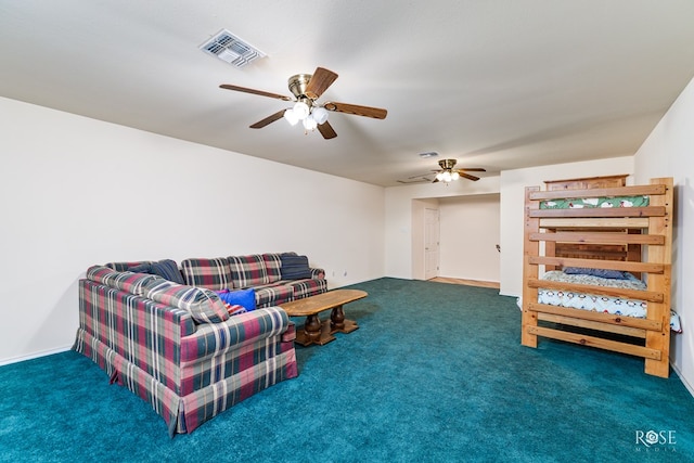 living area with a ceiling fan, carpet, and visible vents