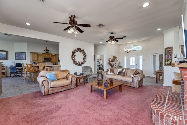 tiled living room with carpet floors, ornamental molding, and visible vents