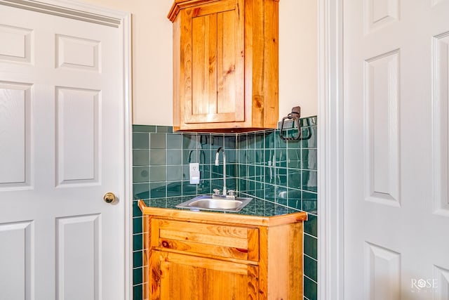 bathroom featuring backsplash and vanity