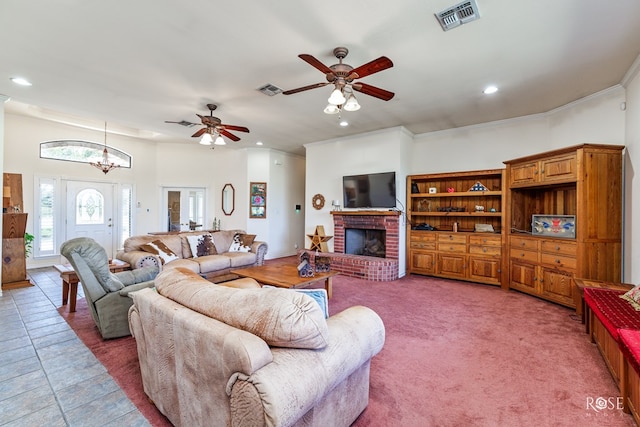 living area featuring recessed lighting, visible vents, ornamental molding, a fireplace, and ceiling fan with notable chandelier