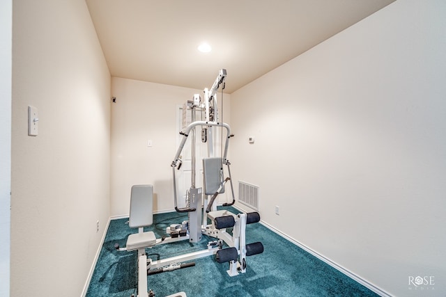 exercise area featuring visible vents, baseboards, and carpet flooring