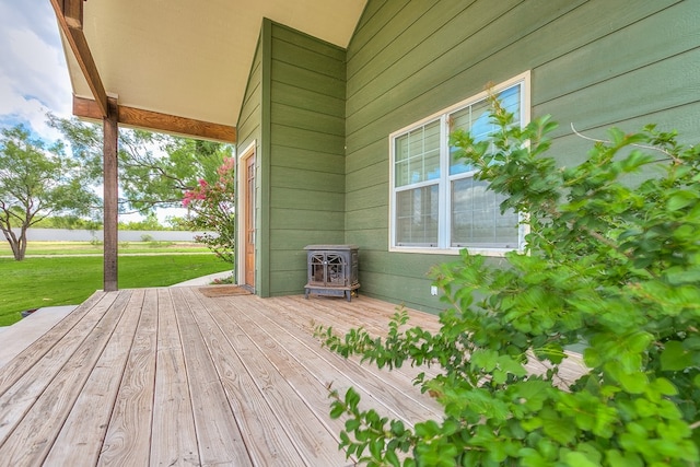 wooden deck with a lawn