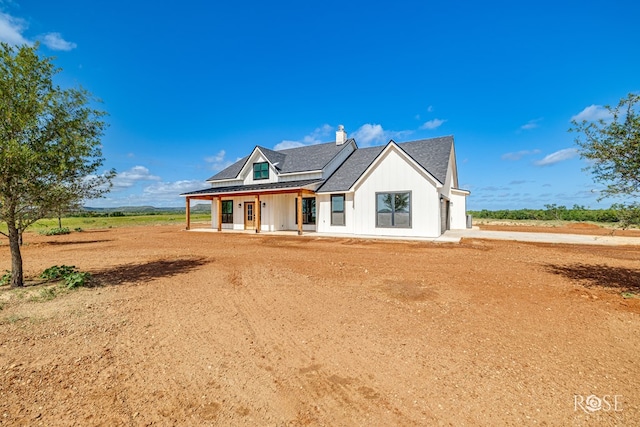 9401 Collett Rd, Robert Lee, TX 76945 - modern inspired farmhouse featuring a porch, a chimney, and board and batten siding