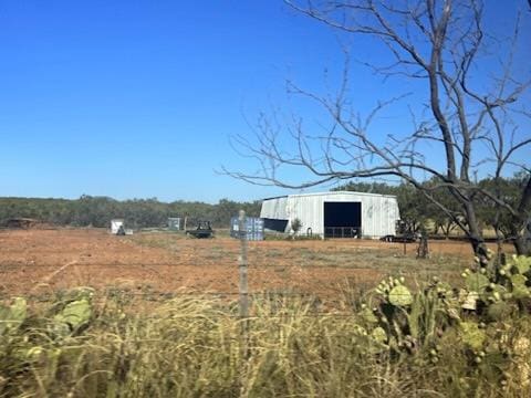 9401 Collett Rd, Robert Lee, TX 76945 - view of yard featuring a pole building and an outdoor structure