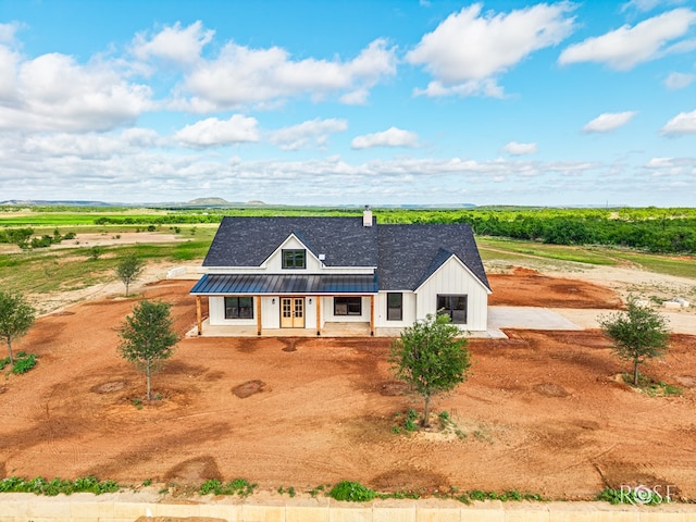 9401 Collett Rd, Robert Lee, TX 76945 - modern farmhouse style home featuring a metal roof, board and batten siding, and a porch
