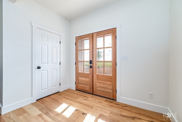 9401 Collett Rd, Robert Lee, TX 76945 - entrance foyer with light wood-style floors and french doors