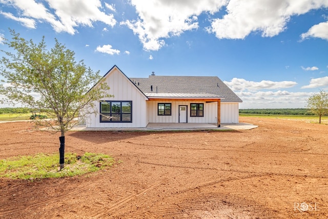 9401 Collett Rd, Robert Lee, TX 76945 - back of house with board and batten siding and covered porch