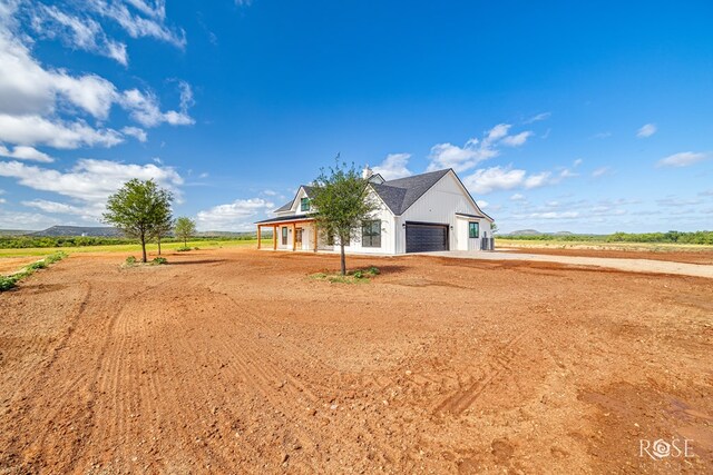 9401 Collett Rd, Robert Lee, TX 76945 - view of front of house with an attached garage and driveway