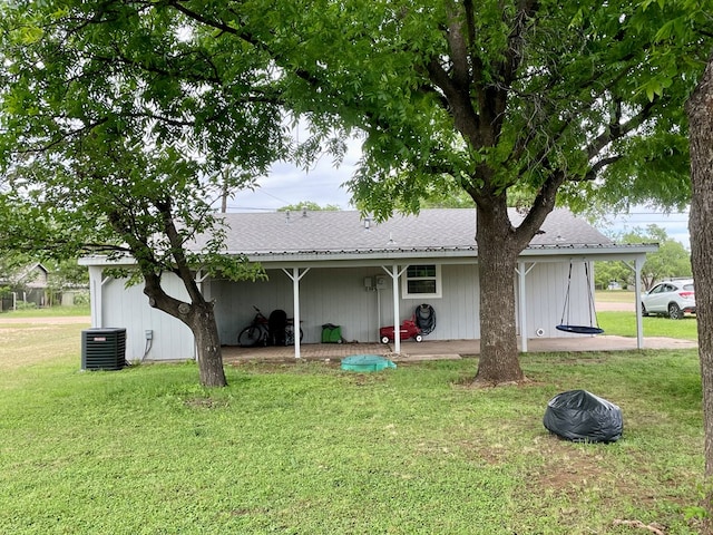 201 N Franklin St, Bronte, TX 76933 - view of front of house featuring a front yard, central air condition unit, a shingled roof, and a patio
