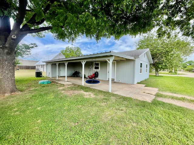201 N Franklin St, Bronte, TX 76933 - back of property with a yard, cooling unit, and an attached carport