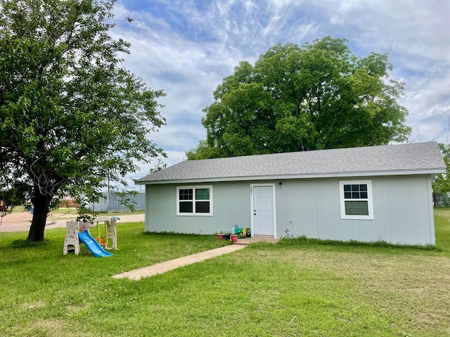 201 N Franklin St, Bronte, TX 76933 - rear view of house with a yard, a playground, and a shingled roof