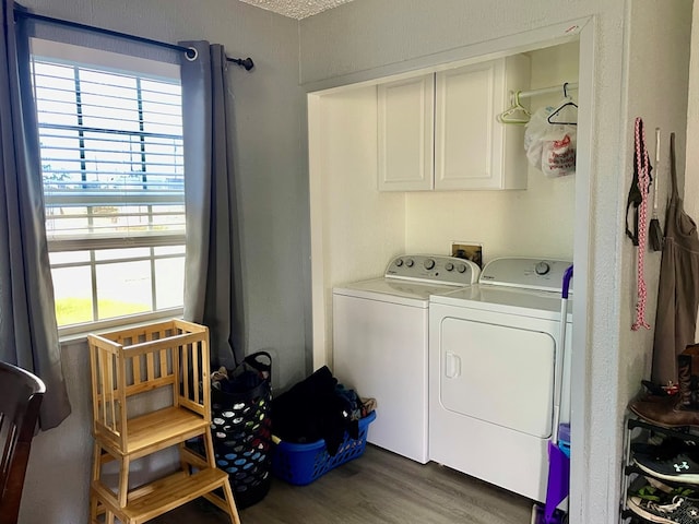 201 N Franklin St, Bronte, TX 76933 - clothes washing area with washing machine and dryer and wood finished floors