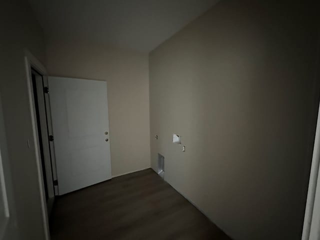 laundry room with dark wood-style flooring