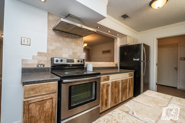 1016 N Adams Ave, San Angelo, TX 76901 - kitchen with visible vents, decorative backsplash, dark countertops, wall chimney range hood, and stainless steel appliances