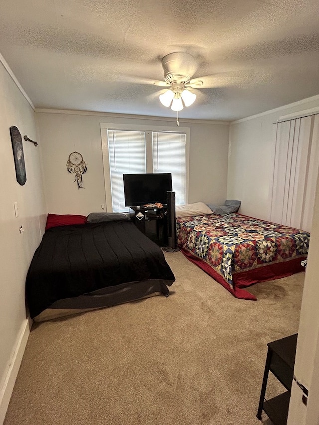 15E 24th St, San Angelo, TX 76903 - carpeted bedroom featuring crown molding, a textured ceiling, and ceiling fan
