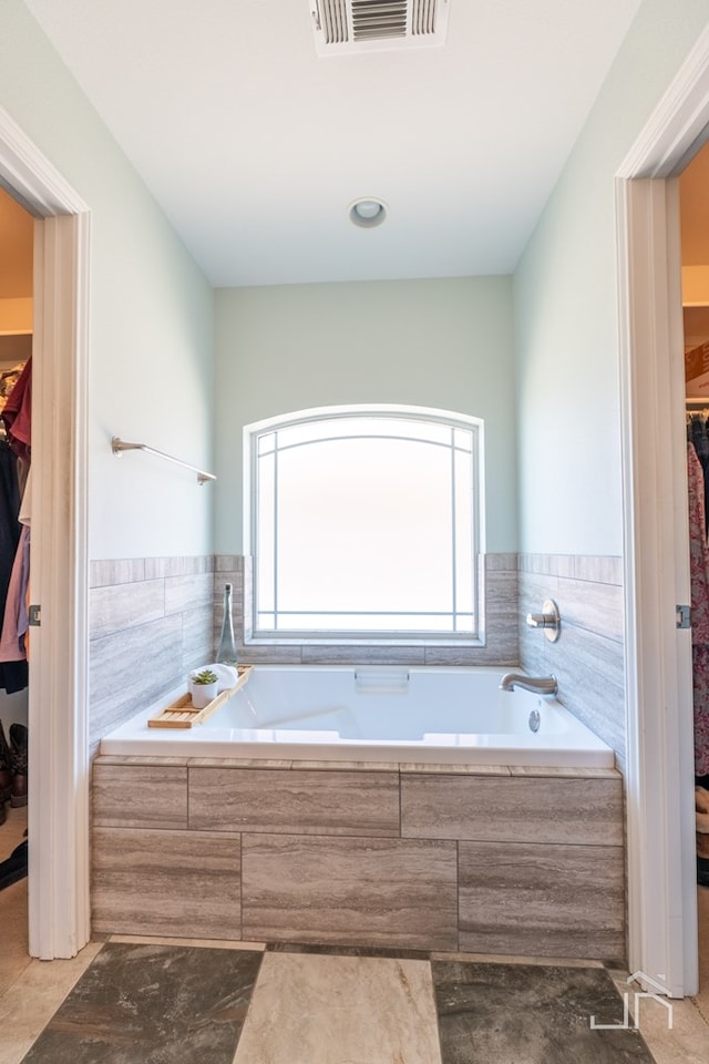 3067 Champions Cir, San Angelo, TX 76904 - full bathroom with a spacious closet and a bath